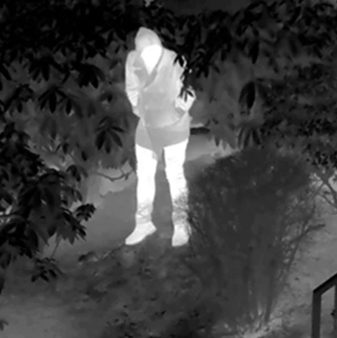 Black and white thermal vision picture of a person
